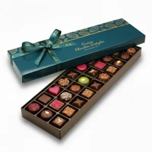 Long custom chocolate gift box with ribbon lid and a colorful assorted chocolate tray.