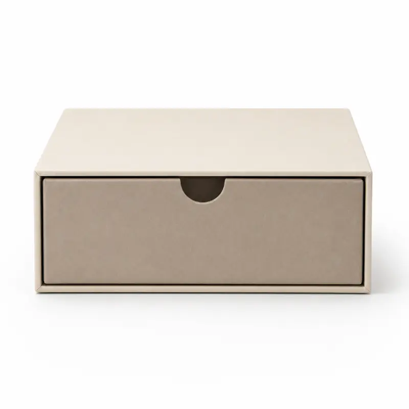 Front view of a closed beige rigid drawer box with an easy-open thumb notch.