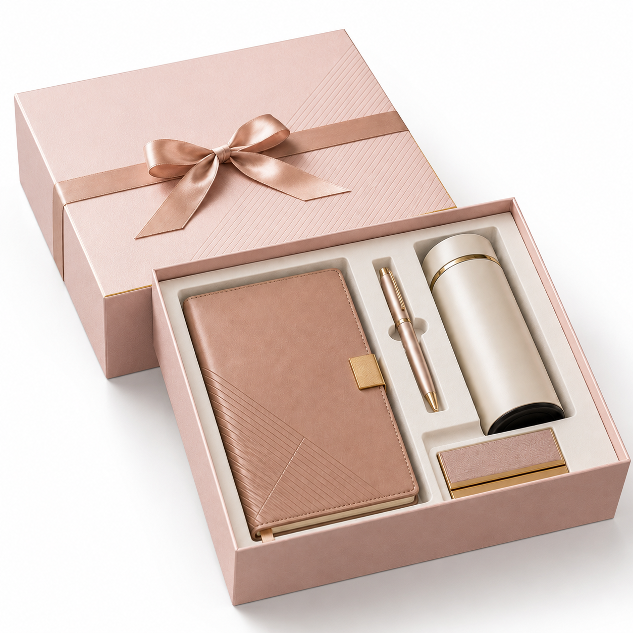Open pink full-cover-lid rigid box with fitted insert for a notebook, pen, and tumbler.